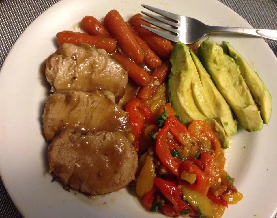 Slow Cooke Pork Tenderloin with baby carrots, roasted red peppers, onions and avocado