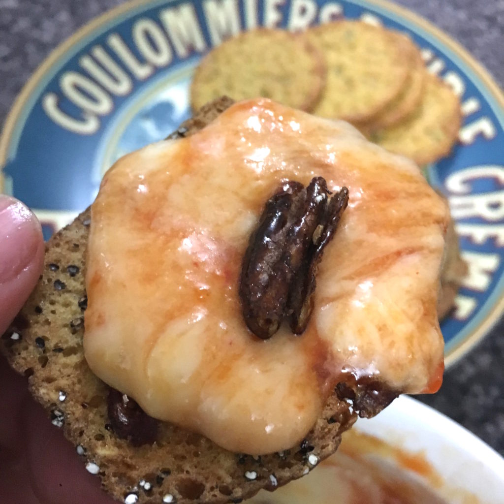 Brie with Red Pepper Jelly and Roasted Candied Pecan on organic artisan crisp cracker