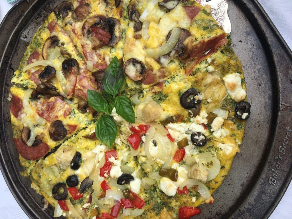 Breakfast Pizza - Salami, red pepper, goat cheese, olives, mushrooms, cheese, egg and onion