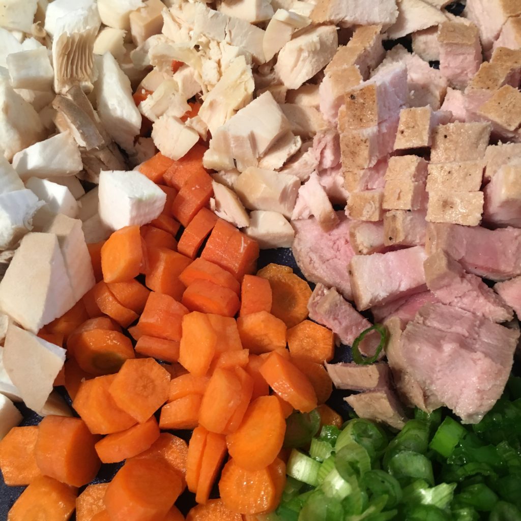 Chopped up vegetables - Carrots, Mushrooms, Green Onion, Chicken Breast and Pork Chop