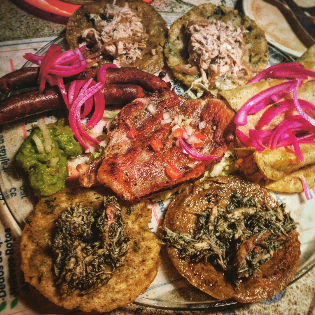 El Cardenal Cantina - Tabla Yucateca platter comes with poc chuc (grilled citrus marinated pork), longaniza (sausage), taquitos regionales, salbut, panuchos, salsas, frijol (beans) and tortillas